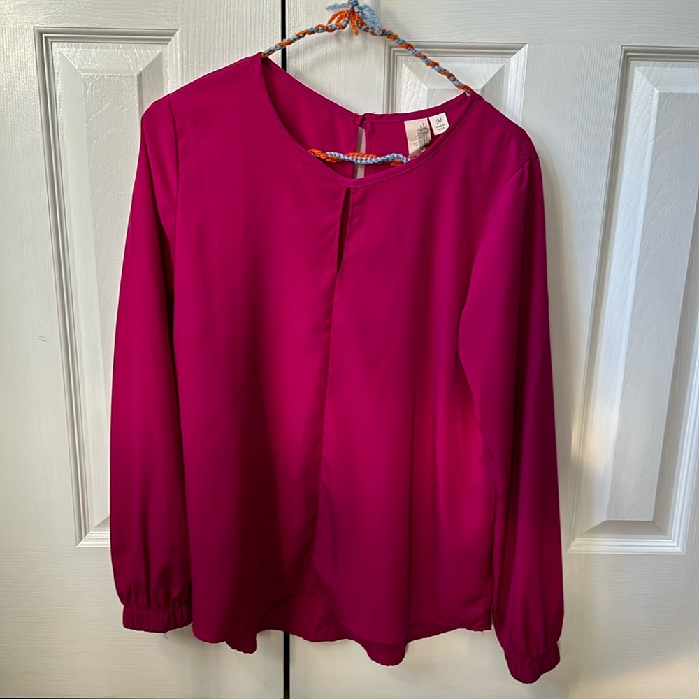 Francesca’s festive magenta blouse with keyhole front and back